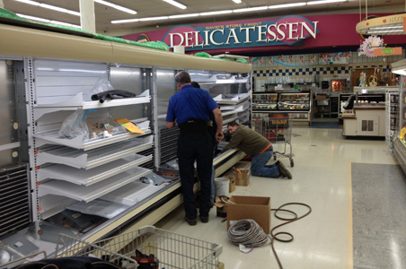 In this image, Lindsey Refrigeration’s professional installers are completing installation of a large multi-level commercial grocery display unit for a large supermarket chain.