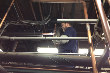 Lindsey Refrigeration is shown installing all the piping necessary for a climate controlled walk-in cooler and walk-in freezer along with the commercial HVAC for this commercial business.