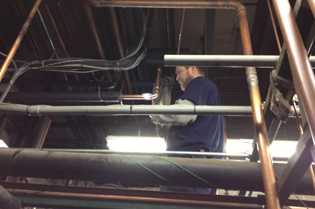 Lindsey Refrigeration is shown installing all the piping necessary for a climate controlled walk-in cooler and walk-in freezer along with the commercial HVAC for this commercial business.